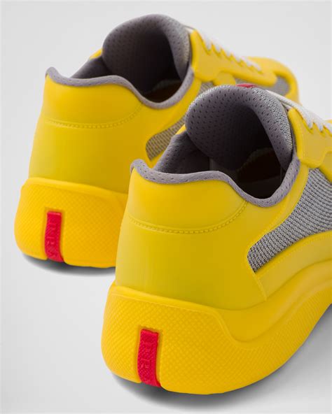 yellow and white Prada sneakers